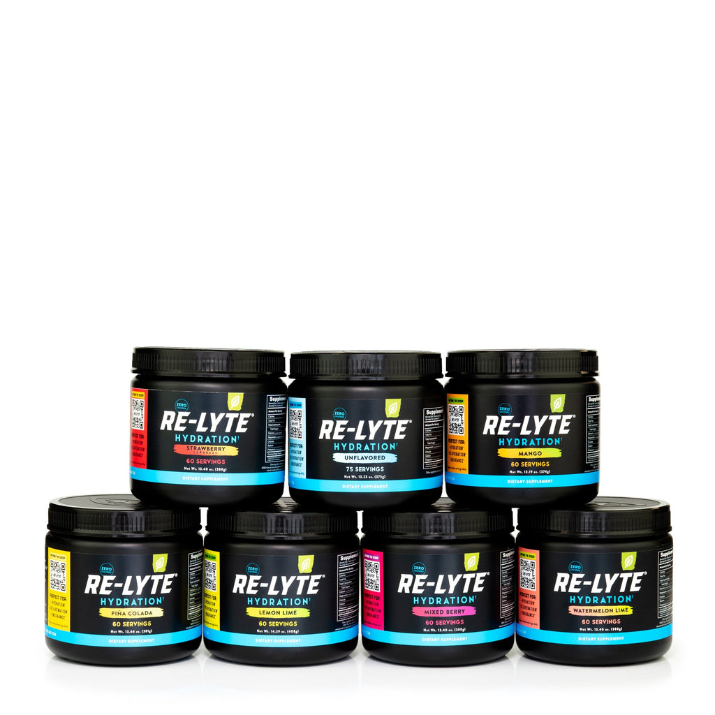 Seven 60 serving jars of Re-Lyte Hydration electrolyte powder stacked on white background. Flavors include strawberry lemonade, unflavored, mango, piña colada, lemon lime, mixed berry and watermelon lime.